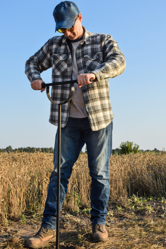 Man Taking A Soil Sample